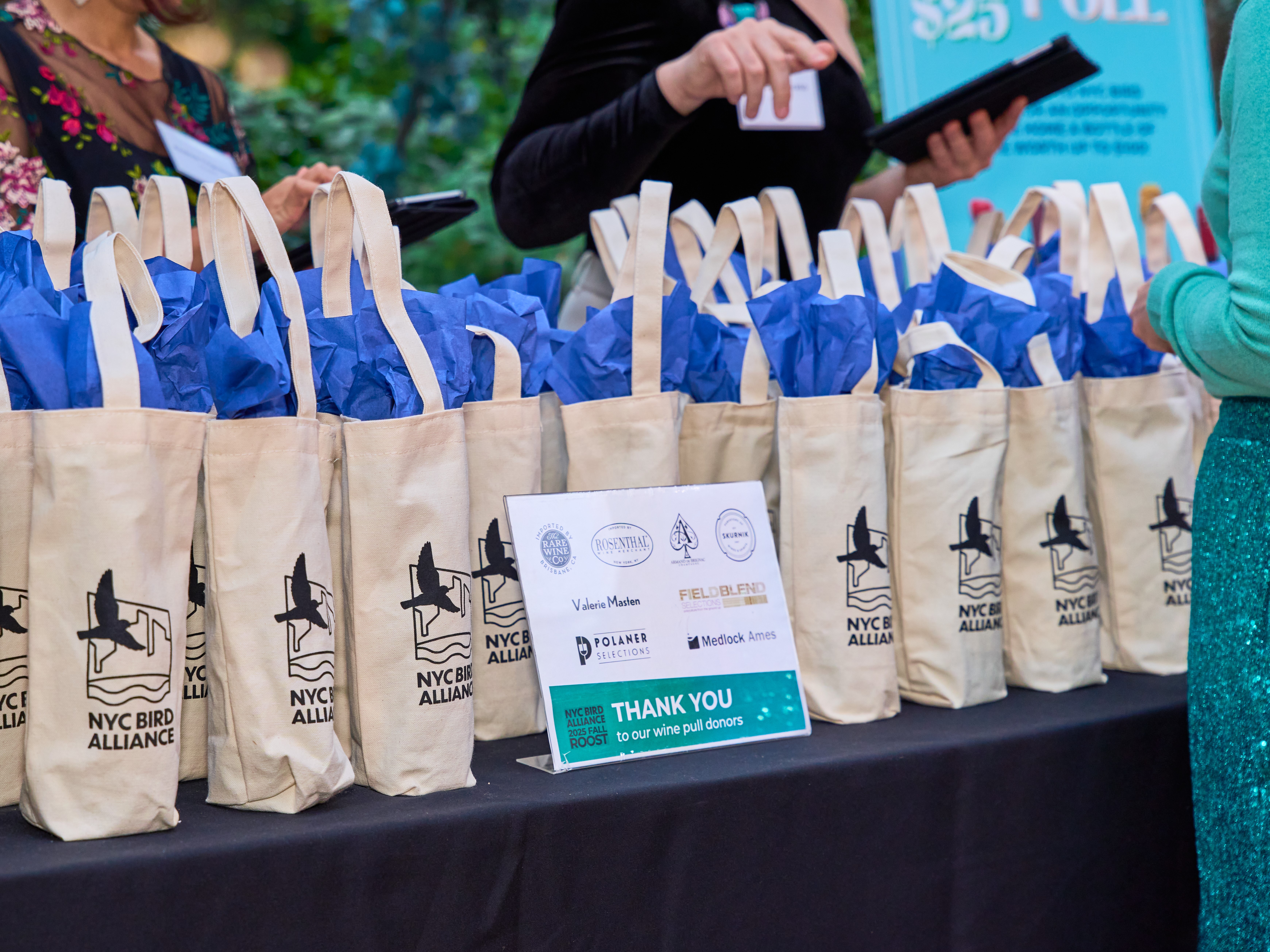 Volunteers help guests at the 2025 Fall Roost wine pull. Photo: Cyrus Gonzeles